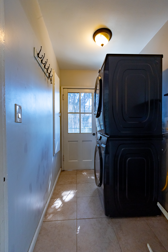 Laundry Room/Side Entrance (brand new stacked gas washer/dryer in unit) - 6401 Arlington Ave