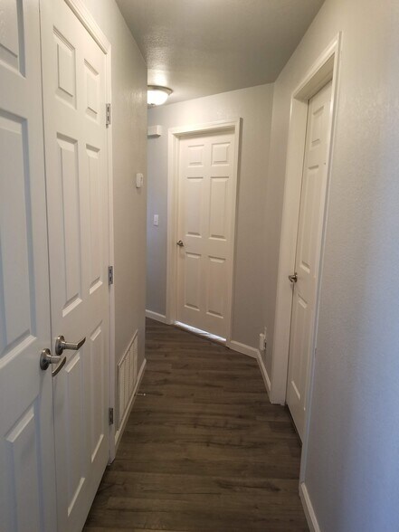 Hallway. Double doors access to washer and dryer in unit - 6964 ASH CREEK HTS