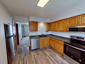 Building Photo - Updated two bedroom ranch duplex with partial basement finish, detached garage, close to mall/sho...