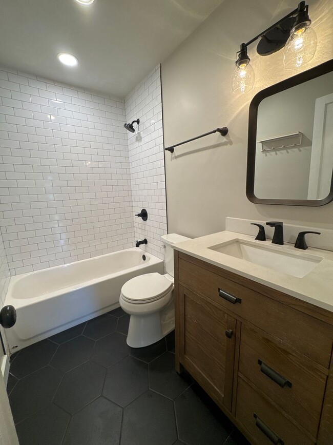Building Photo - Classic charm meets modern comfort in this updated Madison cottage with a large backyard and conv...