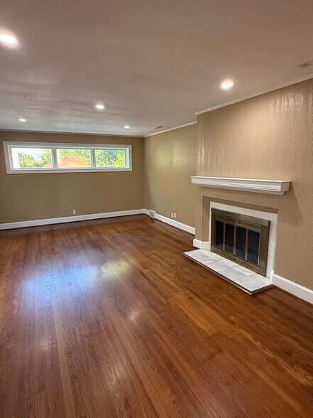 Great Room has Fireplace with White Marble Hearth - 18 Waters Ave