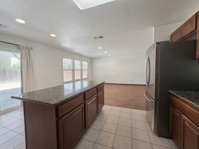 Building Photo - Spacious 4-Bedroom Home with Solar, Finished Garage, Large Pantry & Low-Maintenance Backyard in M...