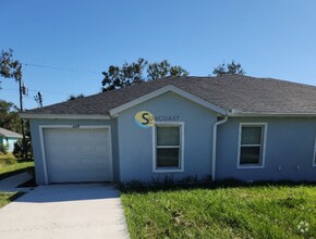 Building Photo - BEAUTIFUL DUPLEX  WITH GARAGE IN FT. MYERS