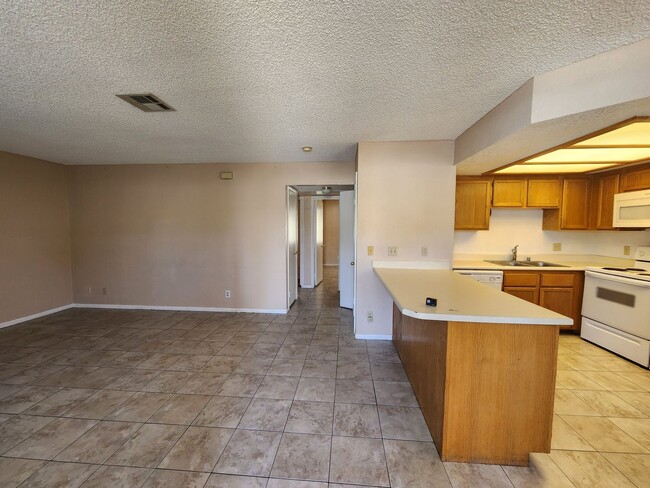 Building Photo - Affordable Condo, Perfect Living Space, Ex...