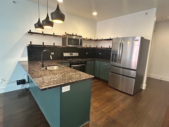 Building Photo - Beautiful Condo with Amazing Roof Top Deck