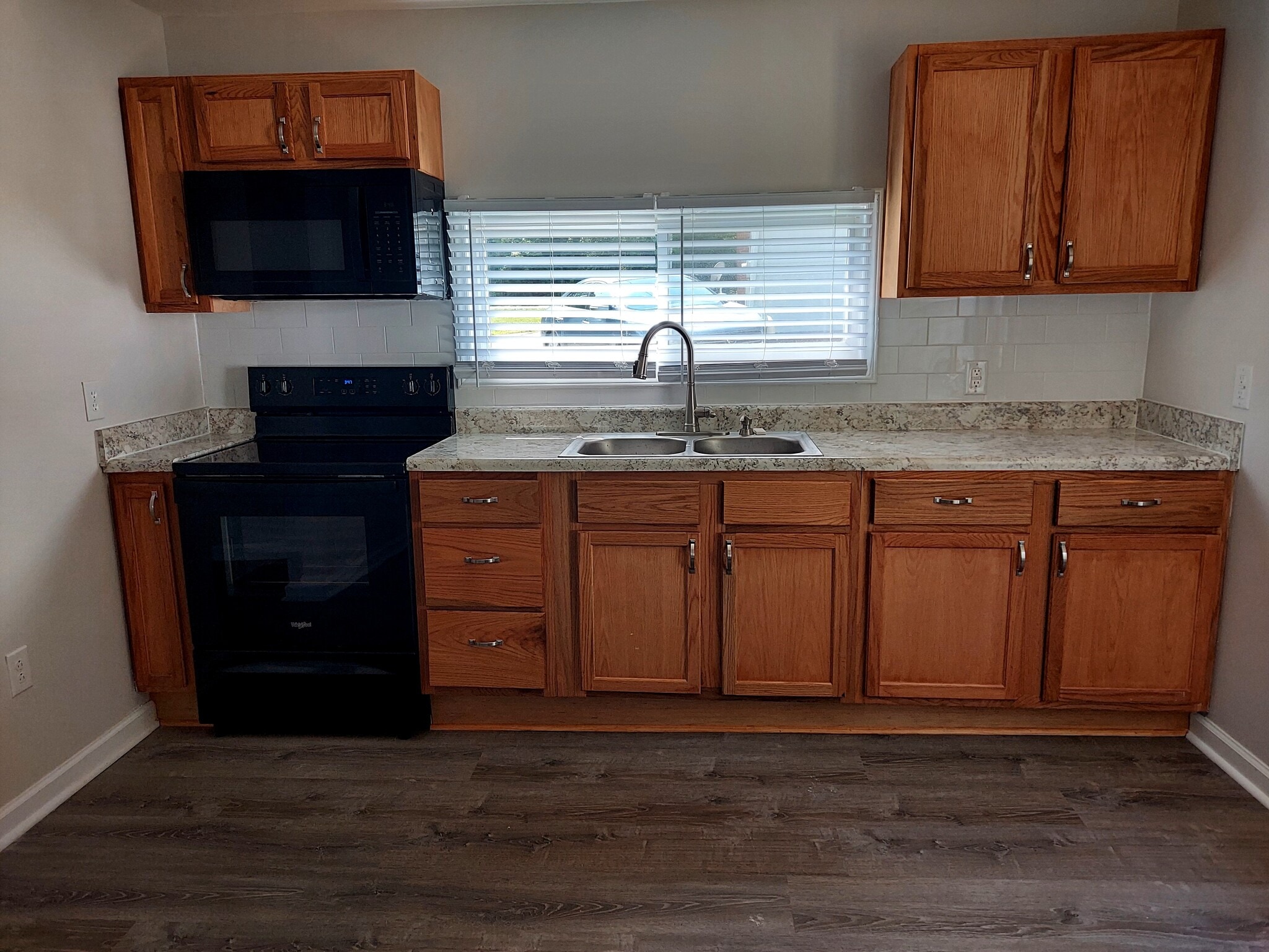 Kitchen with new microwave and stove - 4041 Northampton Dr