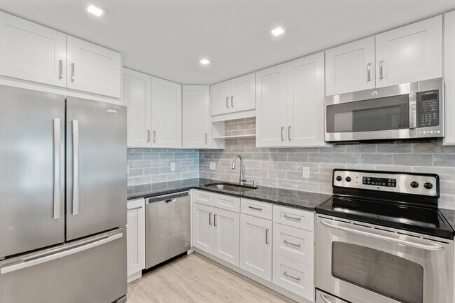 Building Photo - NEWLY RENOVATED TWO BEDROOM CONDO IN WATERFRONT RESORT STYLE COMMUNITY