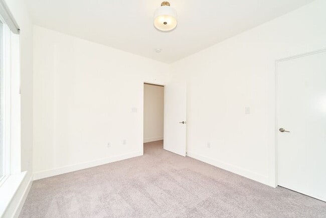 Building Photo - Like New Townhome With Your Own Rooftop Views of Downtown Indy!