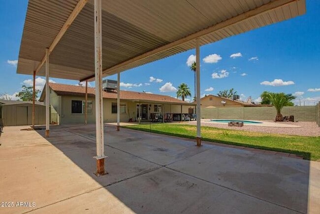 Building Photo - Beautiful three-bedroom, two-bath with pool and RV parking, available now.