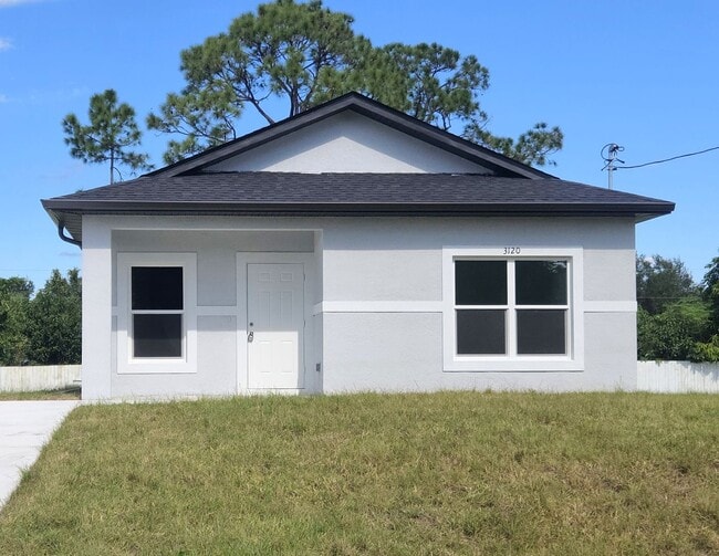 Building Photo - BRAND NEW-- TWO BEDROOM + TWO BATHROOMS- SOUTH LEHIGH ACRES