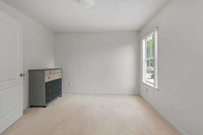 Building Photo - Spacious 3BR Retreat with Soaring Ceilings & Screened Porch