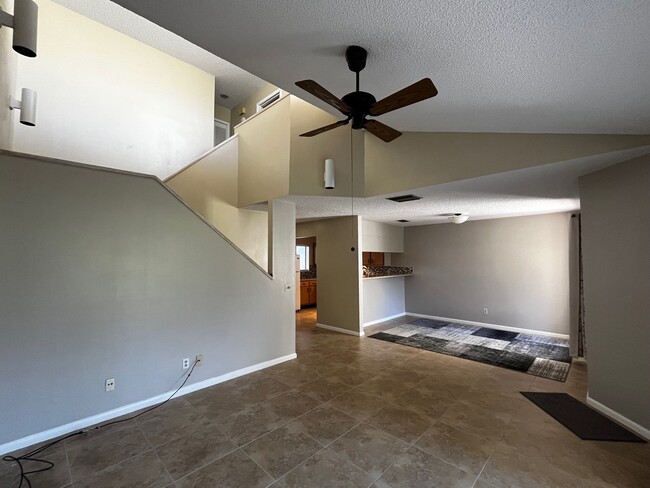 Area rug in dining room can be used or stored in garage - 1694 SW Crossing Cir