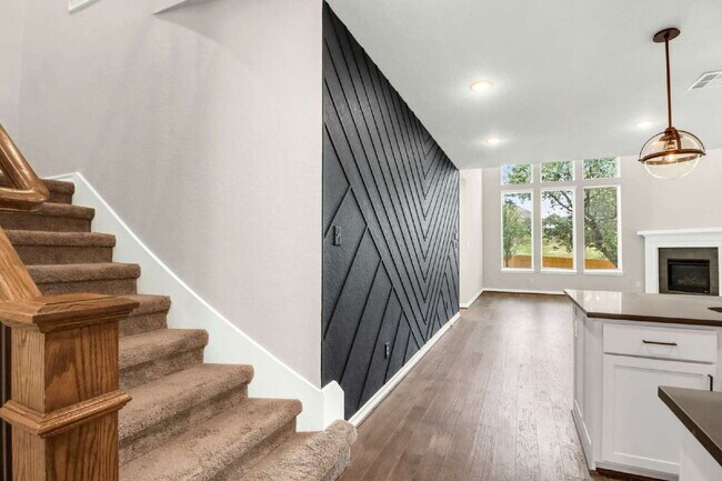 Building Photo - "Spacious 4-Bedroom Sanctuary with Cozy Fireplace in San Antonio's Prime Location!"
