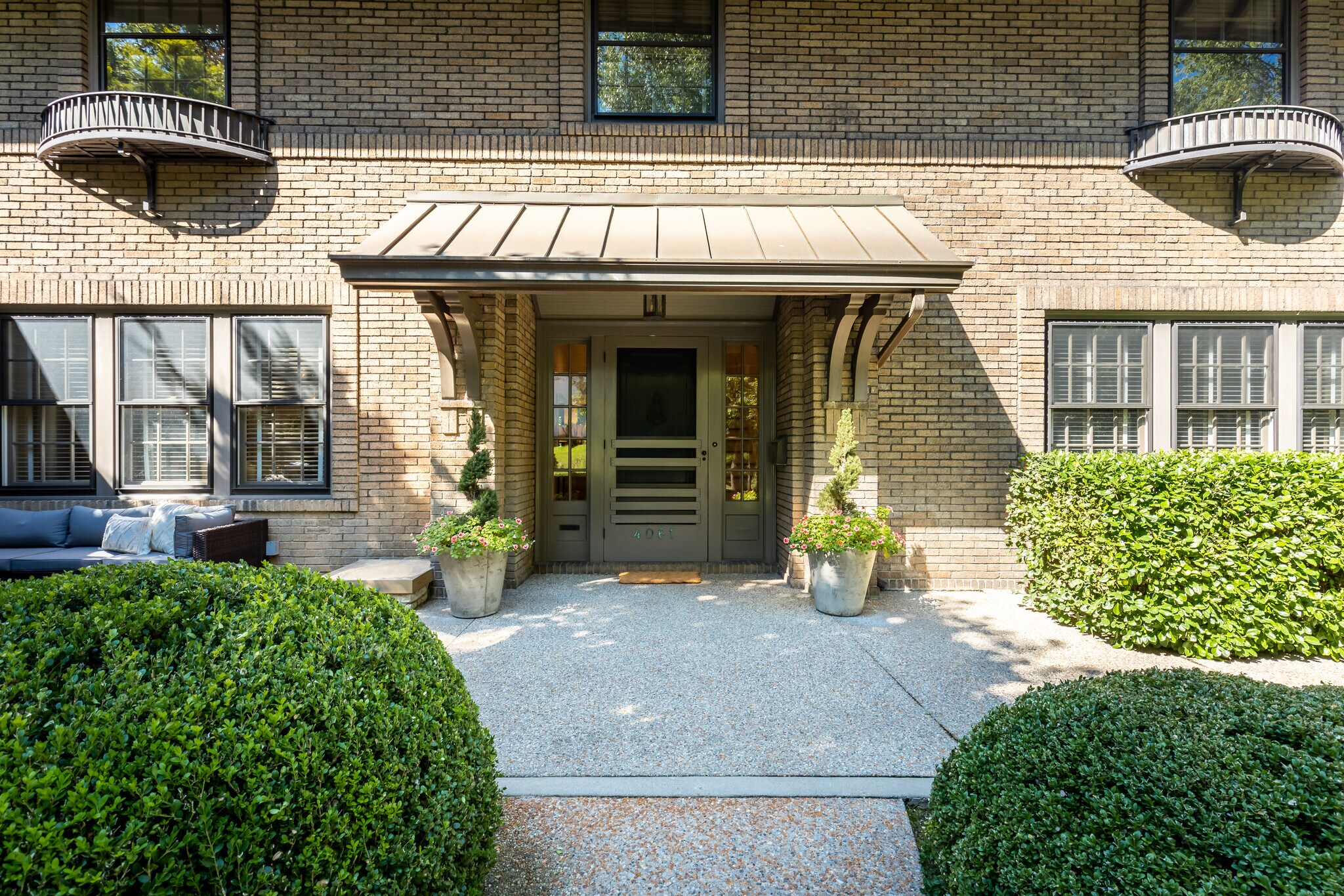 Front door with terrace. - 4061 Beechwood Ave