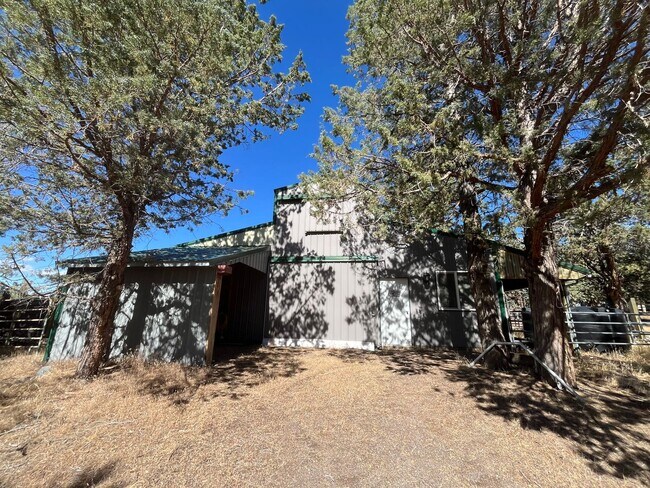 Building Photo - Custom Rustic 4-Bdr on beautiful 5 acres with Greenhouse in Sisters!