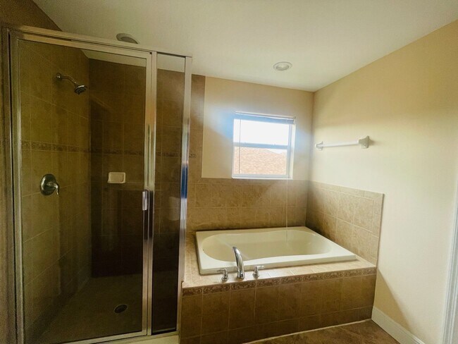 Building Photo - **SUNCOAST LAKES GATED COMMUNITY**