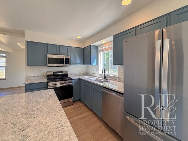 Building Photo - Immaculate Bremerton Home with Expansive Yard, Multiple Living Areas & Designer Kitchen
