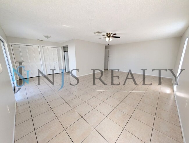 Building Photo - Beautifully updated 3/2/2 1500 Sq. Ft. with fenced yard, tile floors, HUGE living room and a corn...