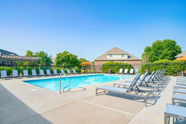 Sunny days are made for poolside fun! Lounge, play, or unwind in our inviting pool area. - Fountain Glen