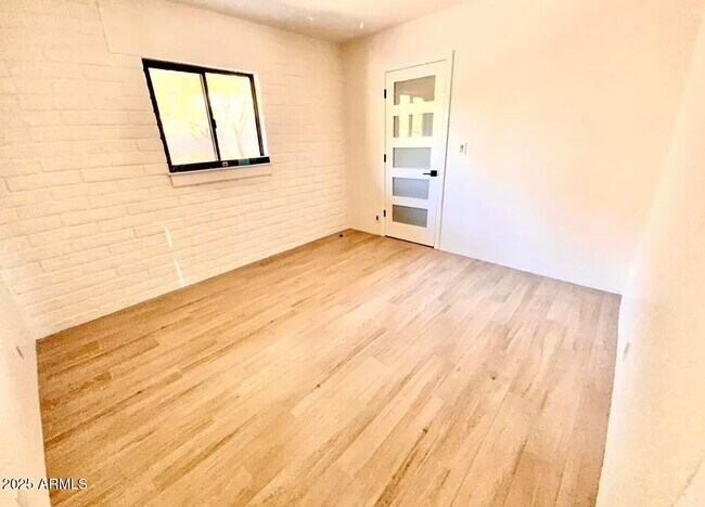 Building Photo - 5811 E Surrey Dr