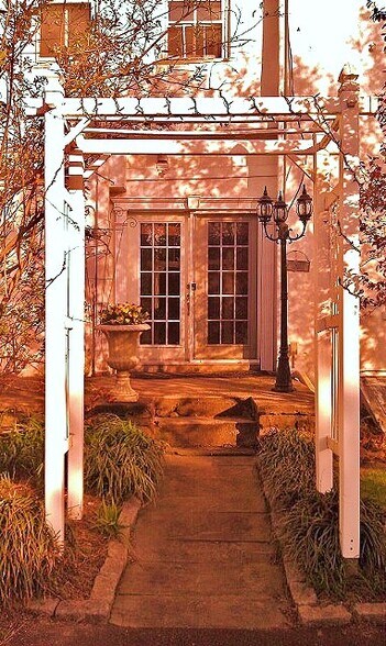 Trellised side entry with perfect place to grill, just off the kitchen garden. - 657 South Sumneytown Pike