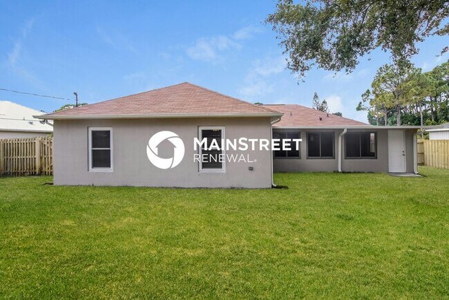 Building Photo - 4 Bedroom Pet-Friendly Home in Palm Bay, FL with Main Street Renewal