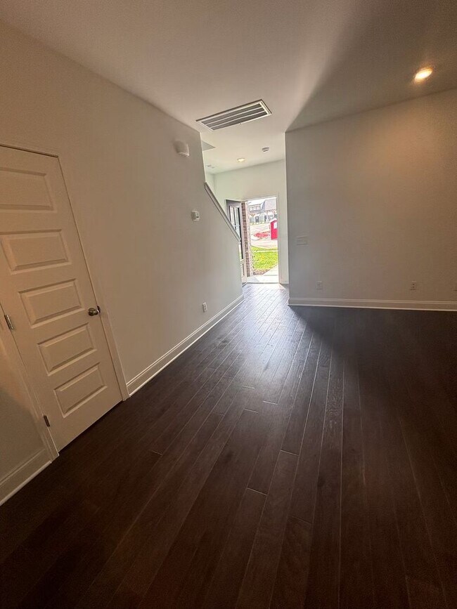 Building Photo - **BE THE LUCKY ONE TO LIVE IN THIS 2024-BUILT END-UNIT TOWNHOME IN A RESORT-STYLE COMMUNITY**