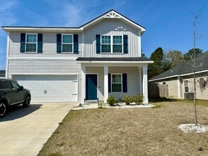 Building Photo - Tranquil South Retreat: Spacious 5-Bed Home with Fenced Yard, Pet-Friendly, Washer/Dryer Included