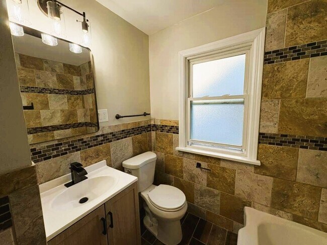 Building Photo - 4-Bedroom Home with Finished Basement & Mo...