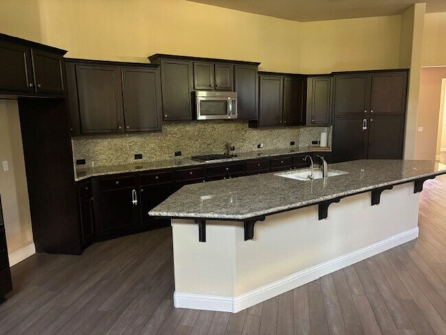 Building Photo - Elegant 4-Bedroom Home with Paid Solar in Gated Village Green Community