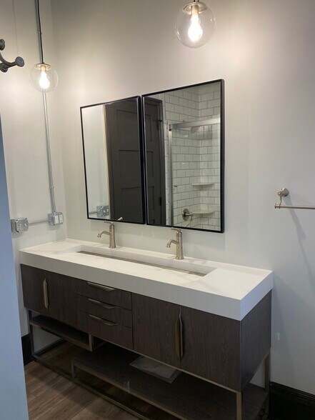 Double faucet vanity. - 102 S Main St