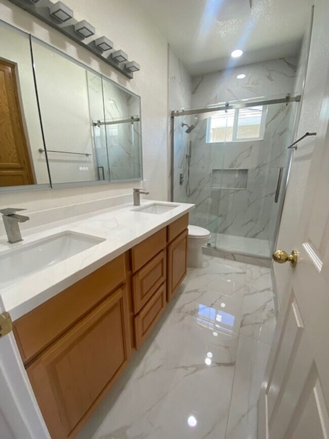 Building Photo - Spacious 5-Bedroom Home with Solar, Stunning Sunroom & Upgraded Bathrooms!