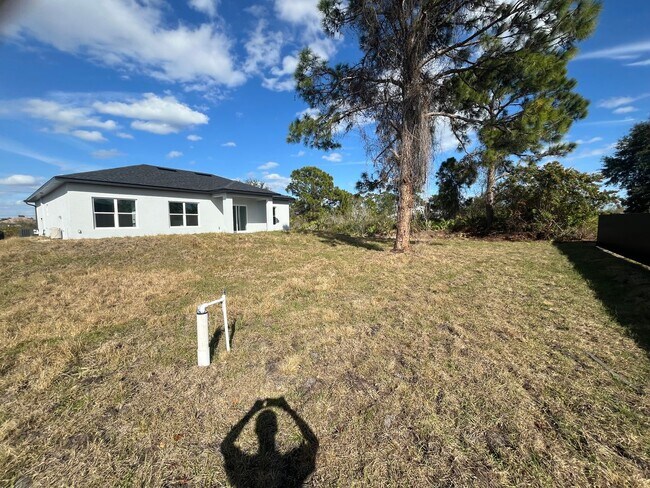 Building Photo - Brand-New 4BR/2BA Luxury Home with 2-Car Garage – Desirable 33971 Location