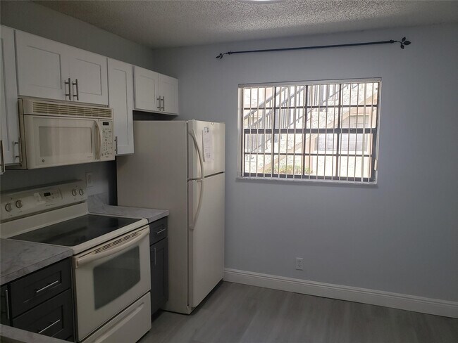 Building Photo - 12252 Royal Palm Blvd