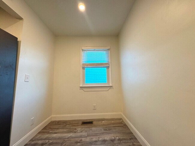 Building Photo - RENOVATED 3 bedroom end unit across the street from the Beach!