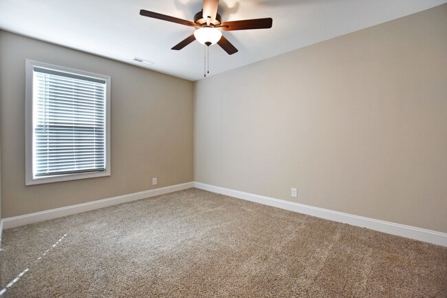 Building Photo - Pet Friendly Three Bedroom with Bonus!