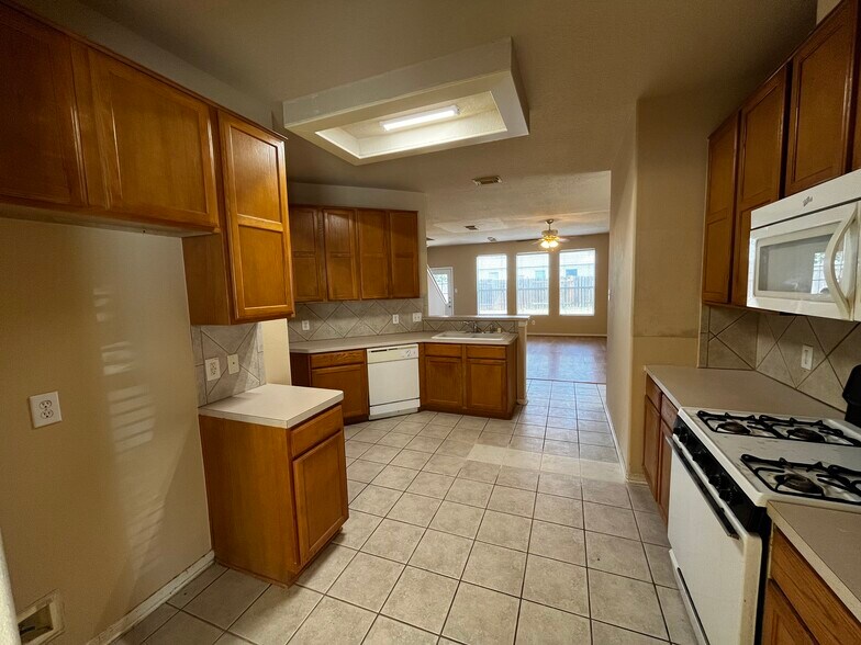 Furnished kitchen with plentiful cabinets & space - 19410 Maywood Falls Cir