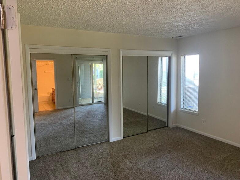 Master bedroom dual mirrored closets - 197 Sugarwood Ln