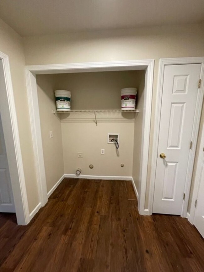 Building Photo - Must see this 4 bedroom 2.5 bath townhouse with 1 car garage .