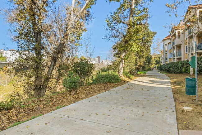 Building Photo - Remodeled River-View Corner Unit with Oversized Patio