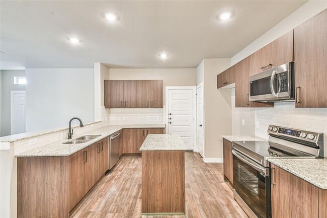 Building Photo - Modern 3-Bedroom Duplex with Granite Counters, Private Yard, and Prime Location