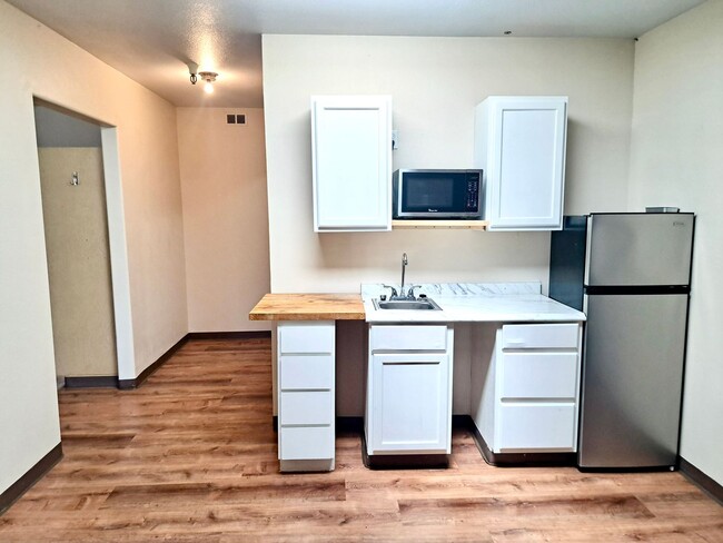 Building Photo - UNDER NEW MANAGEMENT: Accessible Studio w/ Laminate Floors! All-Inclusive "One Bill" Living, Free...