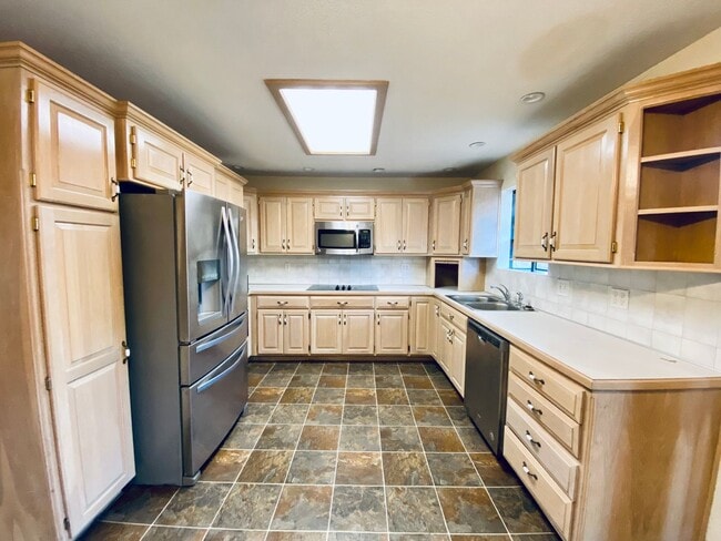 Building Photo - {5639} Spacious Ranch + Two Separate Living Quarters + Fenced Yard!