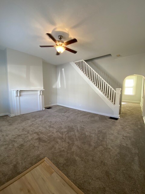 Large, bright living room with high ceilings and original woodwork - 5234 Holmes St