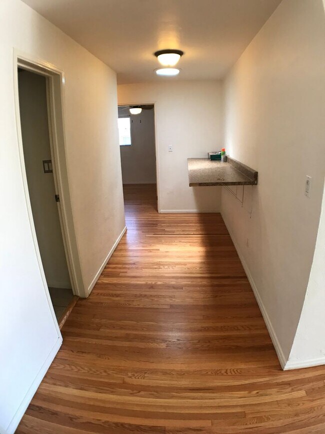 Building Photo - BEAUTIFUL WOOD FLOORS IN THIS- 5 BED 2 BATHROOM- Includes maid service