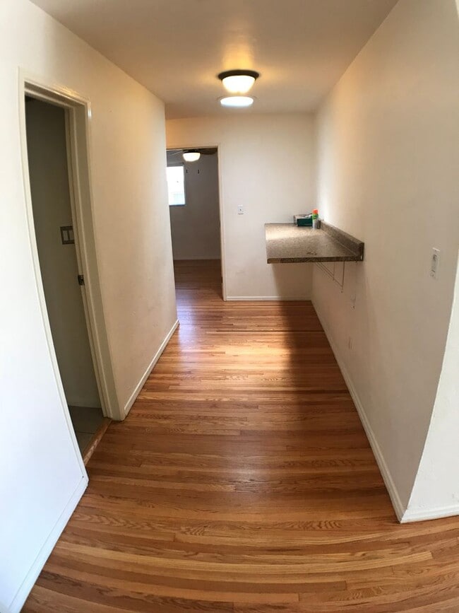 Building Photo - BEAUTIFUL WOOD FLOORS IN THIS 5 BED 2 BATHROOM HOUSE- LARGE DOGS OK