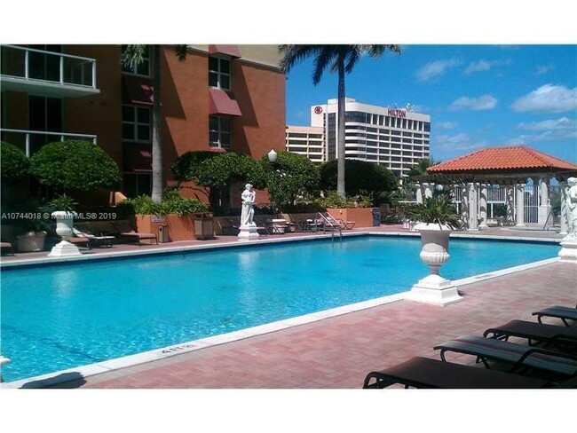 Building Photo - Rare 2/2 Corner Penthouse with Panoramic Lagoon Views from Every Room – Available Now!