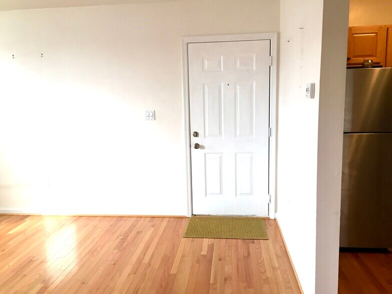 Unit entrance door and kitchen on the right - 730 11th St NE