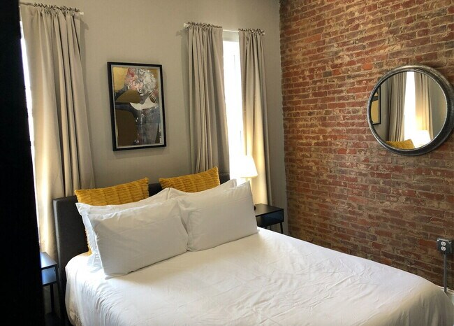 Building Photo - Chic Urban Living: Furnished 2-Bed Townhouse with Finished Basement in Pittsburgh's Strip District!