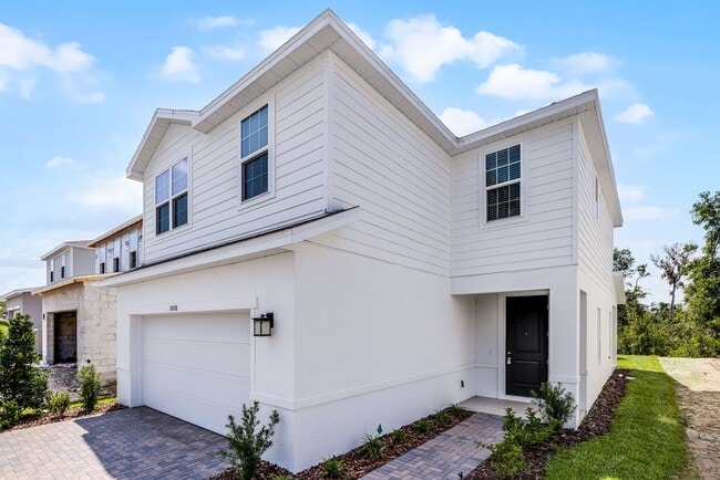 Building Photo - Brand-New 4BR Home with Tile Floors & Quar...